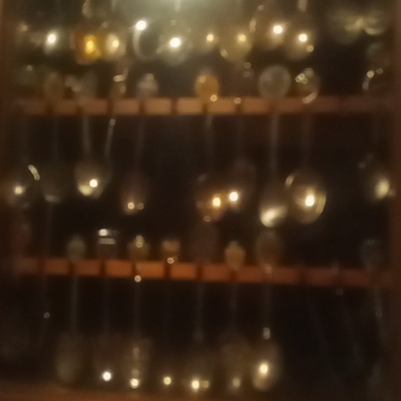 Vintage souvenir spoon collection over 100 spoons.